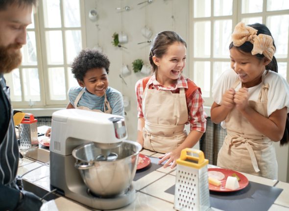 Children learning to cook together