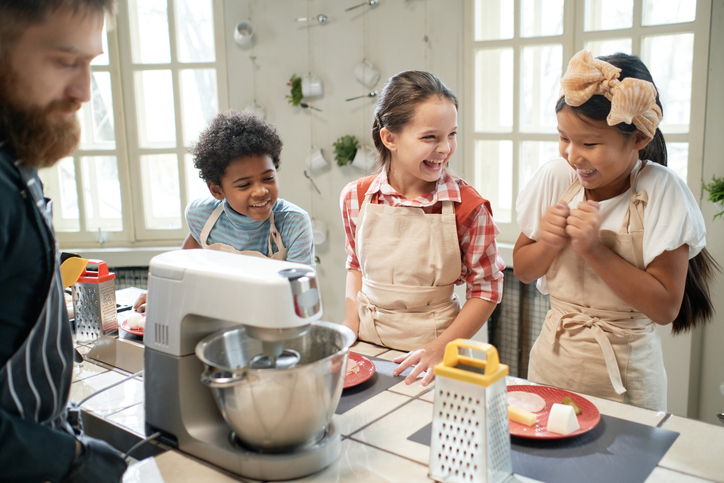 Children learning to cook together